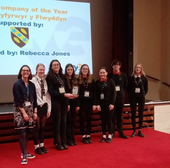 Rebecca Jones and a group of Ysgol Penweddig in a line up receving their award