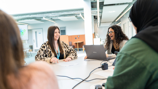 Swansea Psychology Academic and Student Laughing while Engaging in Discussion