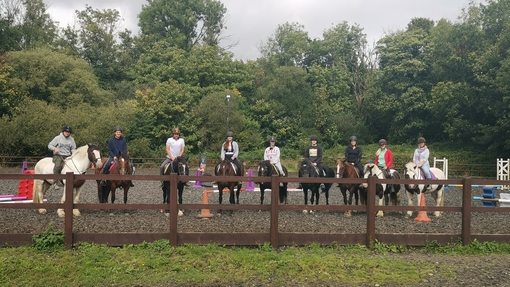 an image of a group of people riding horses