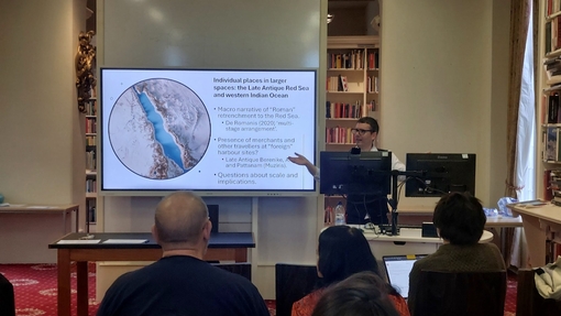 Mathew Cobb of UWTSD presenting during the Going beyond Empires: Oasis Polities, Imperial Frontiers and Trade across Ancient Eurasia in Antiquity conference at UWTSD's Founders Library in Lampeter