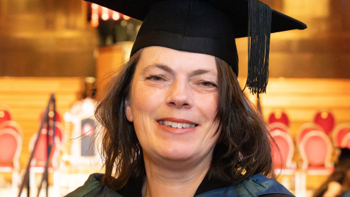 Emma-Jane Wilson in the Brangwyn Hall in her graduation gown 