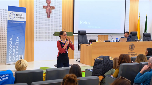Image of Mache talking in the conference