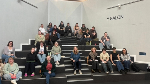 Students sitting in Yr Egin with Tilly Ashton 