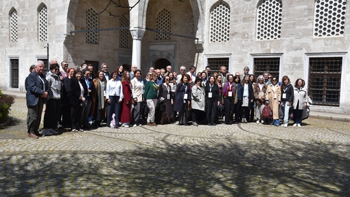Group photo of conference attendees outside venue