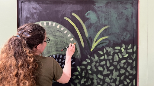 student working on Miss Prydderch set painting