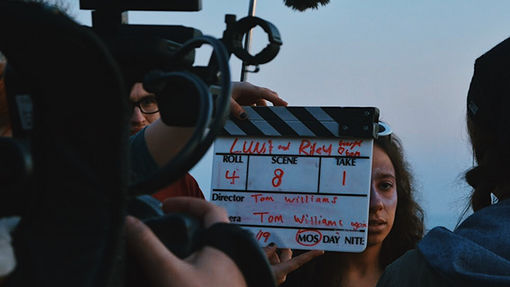 students filming using equipment 
