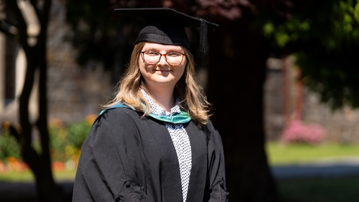Image of Kimberley Skeels in her cap and gown 