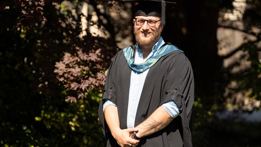 an image of Dan in his cap and gown 