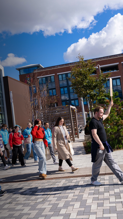 students walking outside IQ