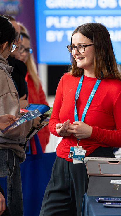 two people talking at an event