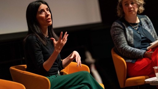 Rocio Cifuentes speaks expressively, one hand held up for emphasis.