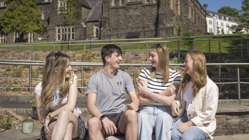 Students sat outside on Carmarthen Campus