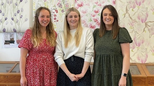 Harriet Popham, Charlotte Field and Grace Exley standing smiling.
