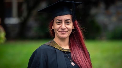 Kaycee Blake smiles in academic dress.