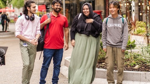 Row of students walking and chatting