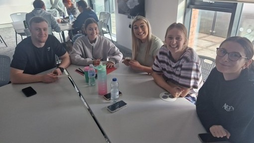 A group of students sitting around a table