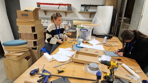 The students are pictured working at CIC's office in Swansea.
