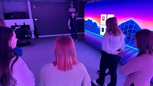 A group of students in the immersive rooms