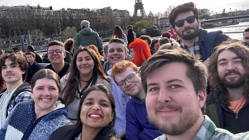 Students enjoying a boat trip whilst in Paris as part of Taith.