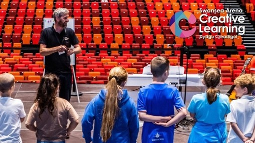 Man facing group of children