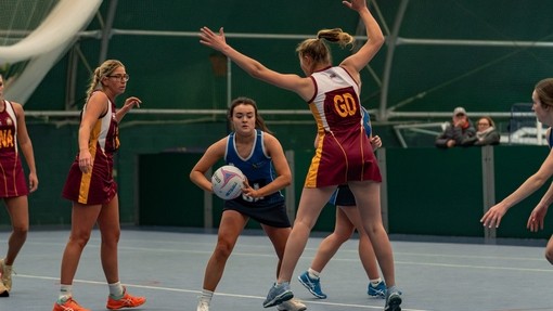 Female students playing netball