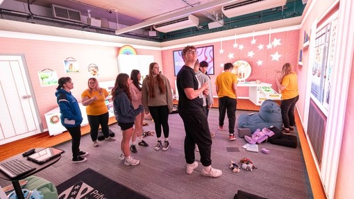 Student inside the immersive room for the Public Services Challenge day