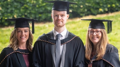An image of the students together in their cap and gown