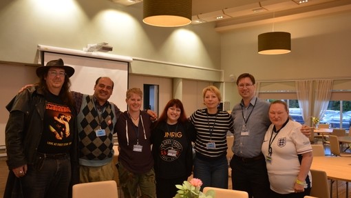 a group of people smiling at camera