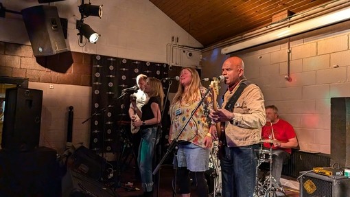 people singing on stage