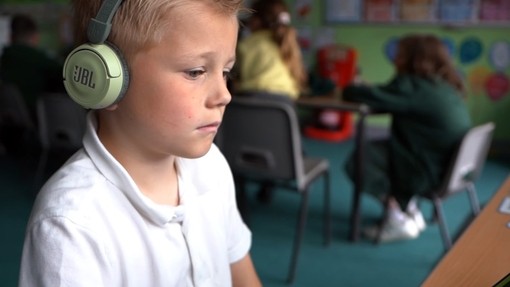 Little boy with headphones on.