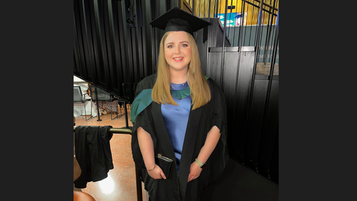 Lydia Davey in her graduation gown in Swansea Bay Arena