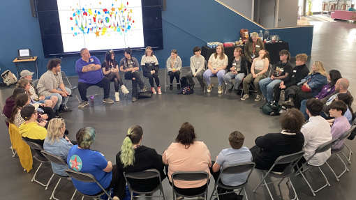 Kyle's evening at Yr Egin - the group sitting around in a circle looking at a screen