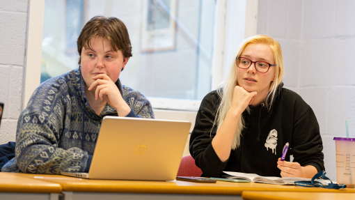 Image of students looking thoughtful in classroom