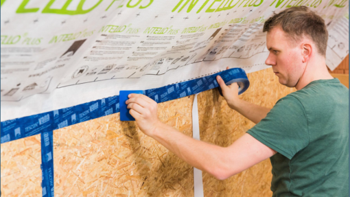 Man in greet t-shirt doing building work