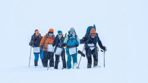 Patrick with a group of students hiking in the snow