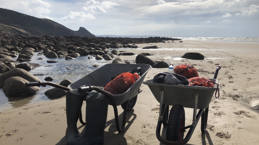 Two wheelbarrows on a beach as part of the Coastal Tales project