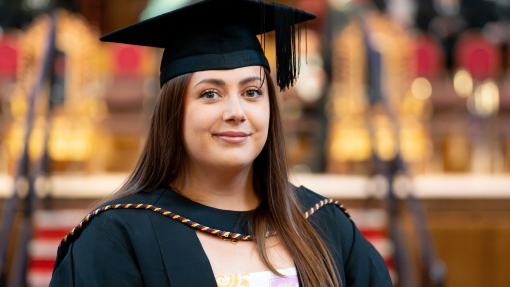 Elyse Hopkins in cap and gown in Brangwyn Hall