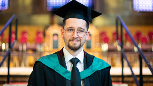 an image of Lewis in his cap and gown