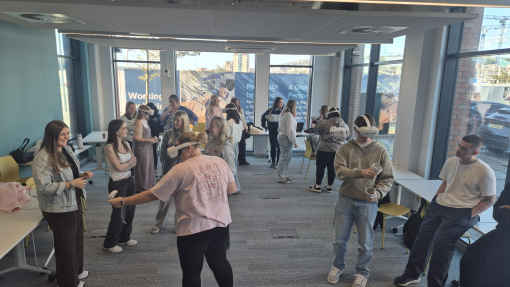 Students wearing VR headsets in a room at UWTSD's SA1 building