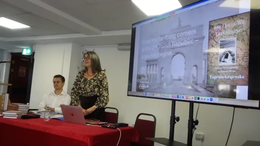 Krystyna Krajewska presenting with projector at front of room during the book launch