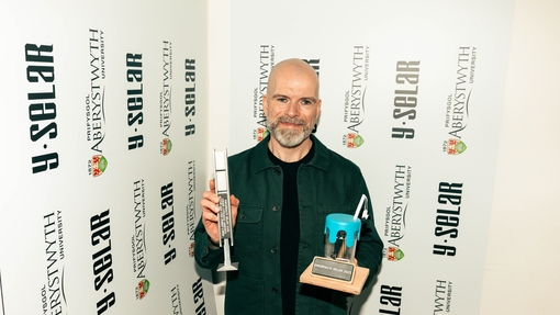 Ed Holden - Life time achievement award at the awards ceremony - holding both trophies