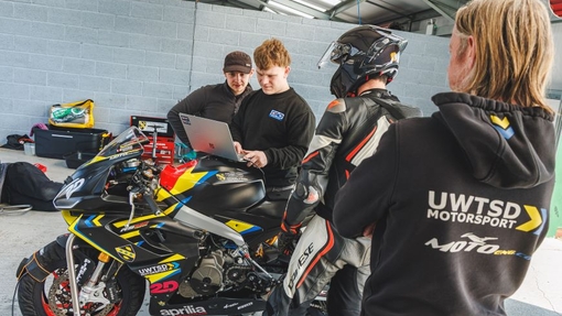 Students working on a race bike.