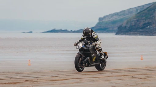 A bike racing on the sand.