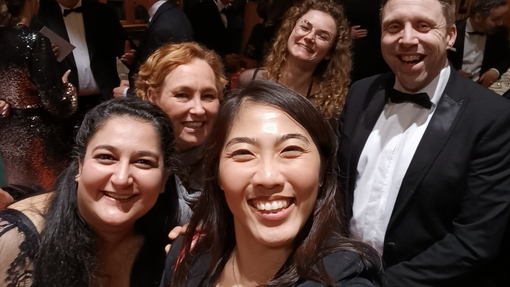 Five people smiling for a selfie