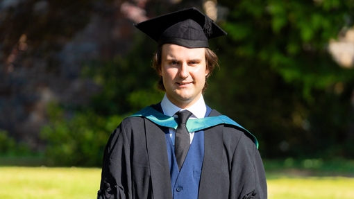 Profile photo of Max Morgan in graduation gown
