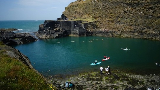 People paddle boarding in the sea