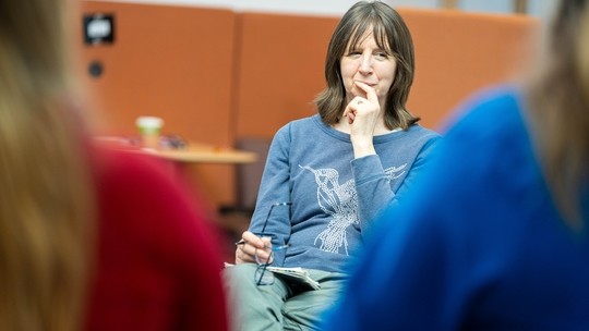 Image of counselling session with counselling pod in the background