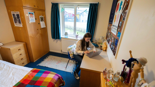 Image of woman working on a laptop