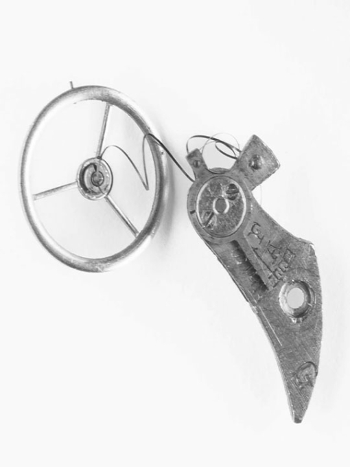 black and white image of clock parts
