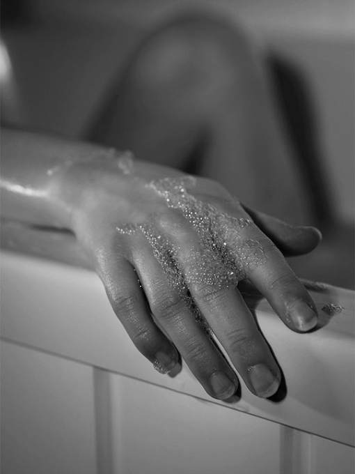black and white image of a hand with bubbles